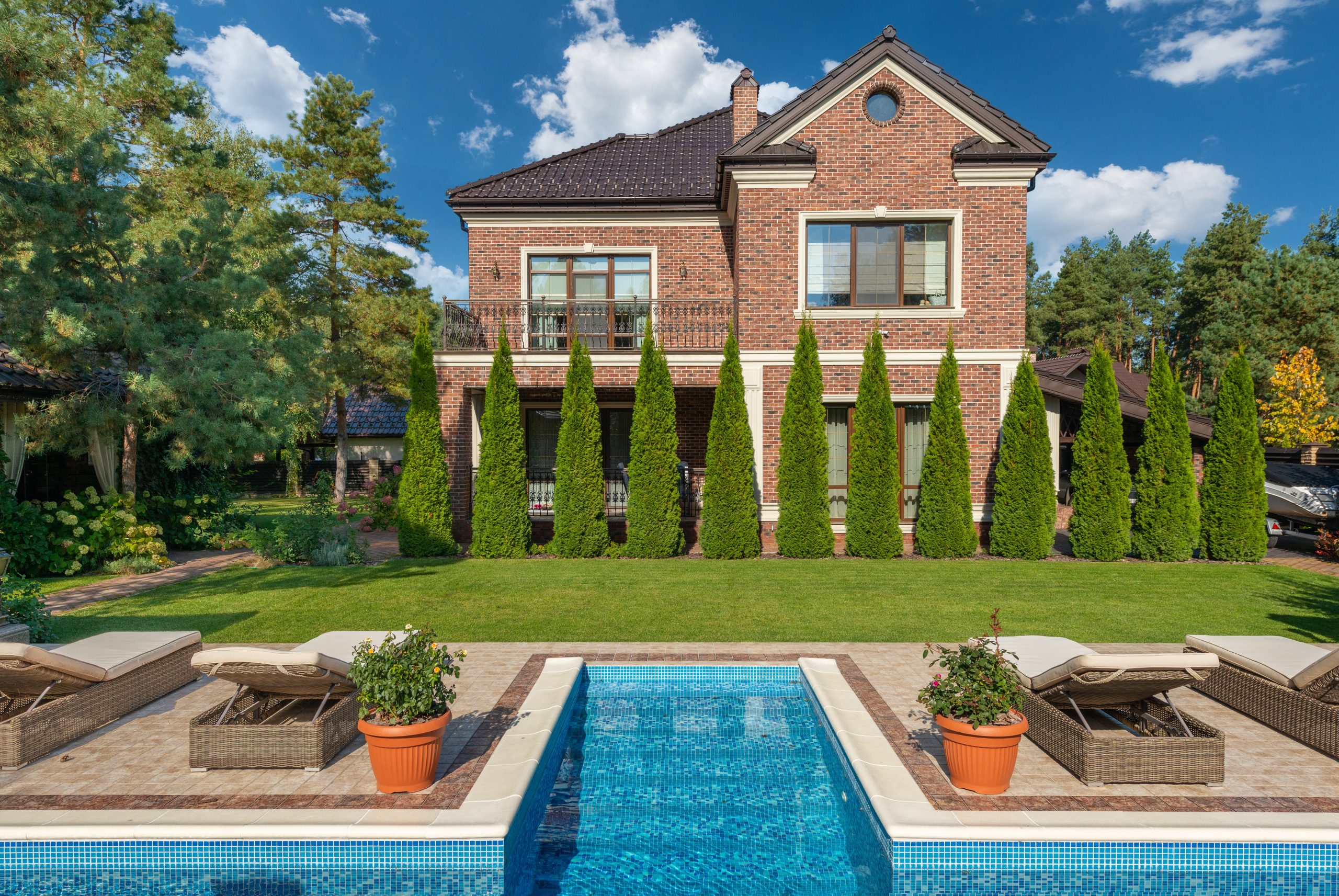 Image of a fancy brick home with elaborate landscaping financed with a home equity loan